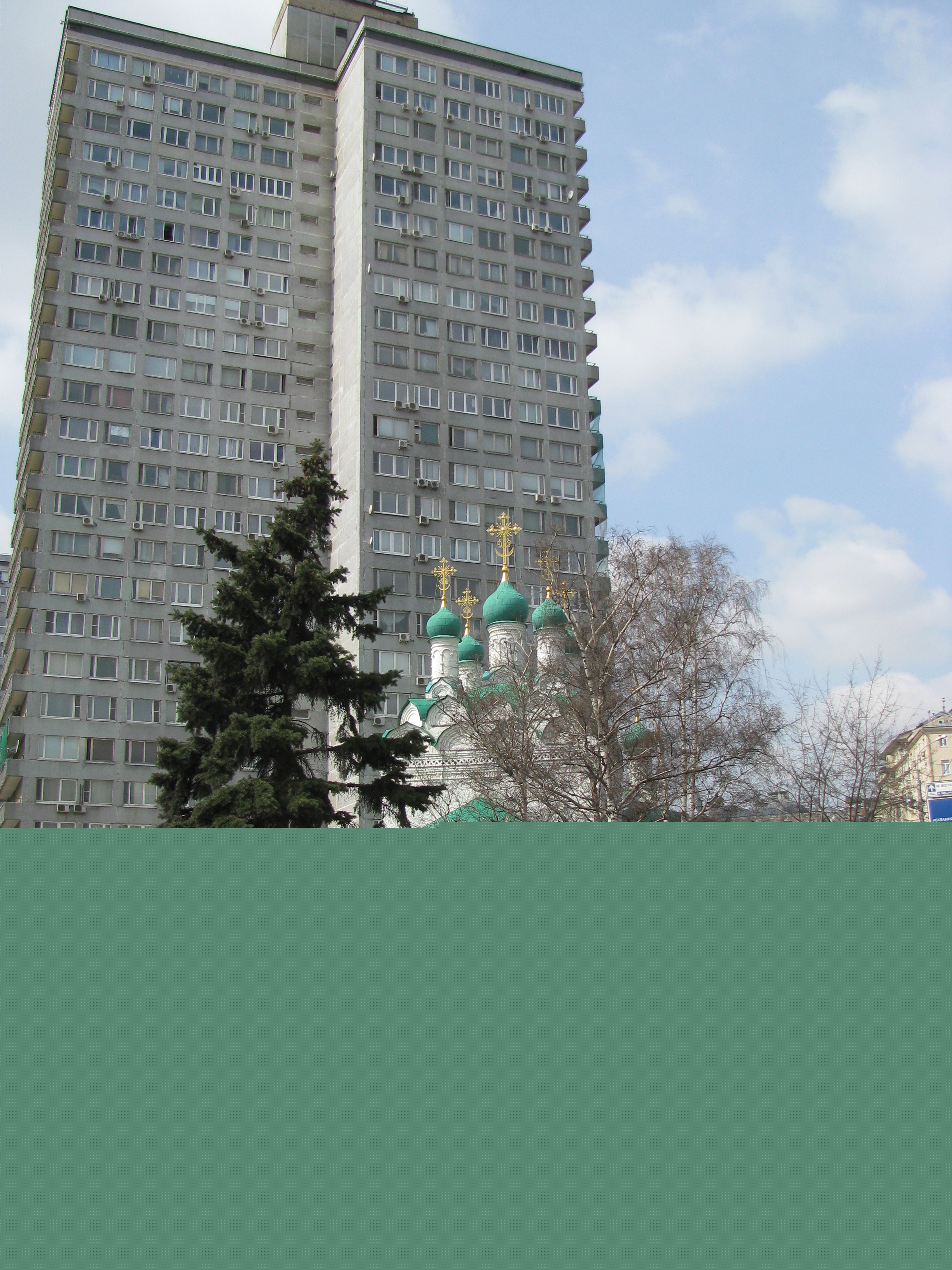 An old Church with a newer building behind it